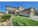Charming two-story home featuring a three-car garage, neutral paint scheme and a front lawn at 3632 Red Fir St, Las Vegas, NV 89135