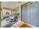 Inviting front porch with seating, a ceiling fan, and a charming front door at 3632 Red Fir St, Las Vegas, NV 89135