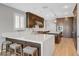 Modern kitchen featuring an island with bar seating and stylish cabinetry at 3632 Red Fir St, Las Vegas, NV 89135