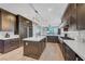Modern kitchen featuring a large island, stainless steel appliances, and plenty of cabinet space at 3632 Red Fir St, Las Vegas, NV 89135