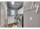 Bright laundry room featuring modern appliances, storage cabinets, and decorative 'Laundry' signage at 3632 Red Fir St, Las Vegas, NV 89135
