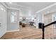 Bright living room with wood floors, neutral paint, shutters, foosball table and plenty of natural light at 3632 Red Fir St, Las Vegas, NV 89135