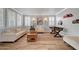 Bright living room with wood floors, neutral paint, shutters, foosball table and plenty of natural light at 3632 Red Fir St, Las Vegas, NV 89135