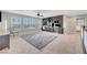 Loft area featuring carpeted floors, plantation shutters, built-in desk and a ceiling fan at 3632 Red Fir St, Las Vegas, NV 89135