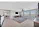 Bright loft area with a large area rug, tv and built in desk at 3632 Red Fir St, Las Vegas, NV 89135