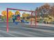 Colorful playground equipment with swings and climbing features offers hours of fun at 3632 Red Fir St, Las Vegas, NV 89135
