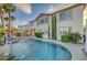A luxurious backyard pool and spa featuring lush tropical landscaping and a serene setting at 3632 Red Fir St, Las Vegas, NV 89135