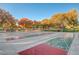 Shuffleboard courts surrounded by vibrant trees and seating areas, perfect for outdoor games and relaxation at 3632 Red Fir St, Las Vegas, NV 89135