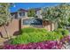 Community entrance sign surrounded by colorful flowers and manicured landscaping at 3632 Red Fir St, Las Vegas, NV 89135