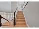 Wooden staircase featuring dark wood banisters and white spindles leading to the second floor at 3632 Red Fir St, Las Vegas, NV 89135