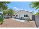 Expansive backyard featuring a patio, desert landscaping, and mature shade trees at 371 Legacy Dr, Henderson, NV 89014