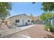 Spacious backyard offers a patio and mature trees, perfect for relaxing at 371 Legacy Dr, Henderson, NV 89014