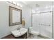 Bathroom features a modern sink vanity, decorative mirror, and updated shower at 371 Legacy Dr, Henderson, NV 89014