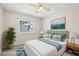 Well-lit bedroom boasts a ceiling fan, a comfy bed, and pleasing decor at 371 Legacy Dr, Henderson, NV 89014