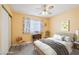 Bright bedroom features a ceiling fan, natural light, and neutral color scheme at 371 Legacy Dr, Henderson, NV 89014