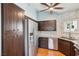 A contemporary kitchen featuring stainless steel appliances, dark cabinetry, light countertops and ample storage at 371 Legacy Dr, Henderson, NV 89014