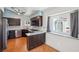 Well lit kitchen featuring stainless steel appliances, dark cabinetry, and a window looking out to an exterior view at 371 Legacy Dr, Henderson, NV 89014