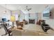 Bright living room features a brick fireplace, large television, and comfortable seating arrangements at 371 Legacy Dr, Henderson, NV 89014