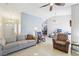 Spacious living room showcasing a comfortable sofa, decorative lamps, and tiled flooring at 371 Legacy Dr, Henderson, NV 89014