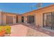 Enclosed backyard with brick patio, desert landscaping, and a private outdoor space at 3815 Atlantis St, Las Vegas, NV 89121