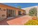 Backyard featuring a brick patio, rock accents, and xeriscape landscaping at 3815 Atlantis St, Las Vegas, NV 89121