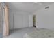Neutral bedroom featuring closet space, a ceiling fan, and sliding glass door to patio at 3815 Atlantis St, Las Vegas, NV 89121