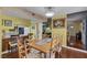 Bright dining room with a connecting kitchen, hardwood floors, and natural light at 3815 Atlantis St, Las Vegas, NV 89121