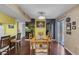 Warm-toned dining room featuring a wooden dining table and chairs with decorative accents at 3815 Atlantis St, Las Vegas, NV 89121
