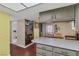 Open kitchen featuring a breakfast bar, wood floors, and great natural light at 3815 Atlantis St, Las Vegas, NV 89121