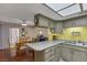 Modern kitchen with a breakfast bar, plenty of natural light, and stainless appliances at 3815 Atlantis St, Las Vegas, NV 89121