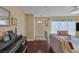 Cozy living room with laminate flooring, an entry way, and lots of natural light at 3815 Atlantis St, Las Vegas, NV 89121