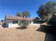 A well kept home has a low maintenance backyard with a rock garden and tiled roof at 3920 Aspencrest Dr, Las Vegas, NV 89108
