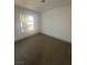 Bedroom with a view of mature trees at 3920 Aspencrest Dr, Las Vegas, NV 89108