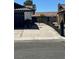 This home has a driveway with a black wrought iron fence and tiled roofing at 3920 Aspencrest Dr, Las Vegas, NV 89108