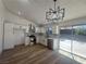 Newly remodeled kitchen boasts modern stainless steel appliances and bright white cabinets at 3920 Aspencrest Dr, Las Vegas, NV 89108