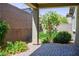 Covered patio overlooking the green backyard and colorful landscaping at 393 Mullen Ave, Henderson, NV 89044