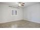Bright bedroom featuring tile flooring, a ceiling fan, and natural light from the window at 393 Mullen Ave, Henderson, NV 89044