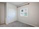 Comfortable bedroom with carpeted floors, a closet, and natural light from the window at 393 Mullen Ave, Henderson, NV 89044