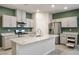 Spacious kitchen with stainless steel appliances, center island, and ample cabinet space at 393 Mullen Ave, Henderson, NV 89044