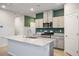Open kitchen featuring granite countertops, stainless steel appliances, and a functional layout at 393 Mullen Ave, Henderson, NV 89044