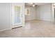 Open floor plan showcases tile flooring, ample space, and a door to the outdoor area at 393 Mullen Ave, Henderson, NV 89044
