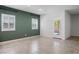 Spacious living room with tile floors, with white trim and window shutters for natural light at 393 Mullen Ave, Henderson, NV 89044