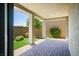 Outdoor patio with view of the lush landscaping in the backyard at 393 Mullen Ave, Henderson, NV 89044