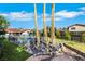 Expansive backyard featuring a sparkling pool with fence, lush landscaping, and mature palm trees, offering privacy at 4143 Chela Cir, Las Vegas, NV 89120