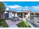 Charming backyard with a covered patio, lush greenery, and a picnic table, creating a perfect outdoor oasis at 4143 Chela Cir, Las Vegas, NV 89120