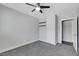 Bright bedroom featuring a ceiling fan, carpet, and closet, offering a comfortable and versatile space at 4143 Chela Cir, Las Vegas, NV 89120