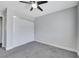 Neutral bedroom featuring a ceiling fan, carpet, and closet with sliding doors, creating a cozy and stylish space at 4143 Chela Cir, Las Vegas, NV 89120