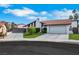 Charming single-story home features a red tile roof, a well manicured yard and a two car garage at 4143 Chela Cir, Las Vegas, NV 89120