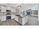 Modern kitchen featuring stainless steel appliances, island, and stylish finishes at 4143 Chela Cir, Las Vegas, NV 89120