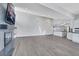 Large living area with fireplace and open access to a modern kitchen at 4143 Chela Cir, Las Vegas, NV 89120